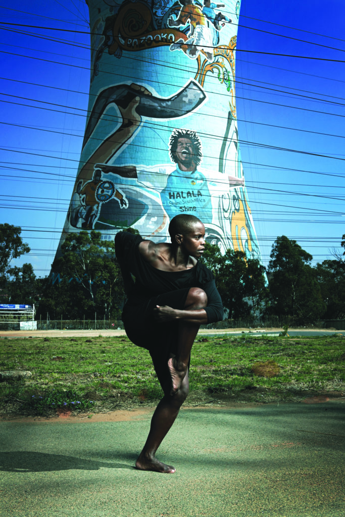 Alvin-Ailey-American-Dance-Theaters-Hope-Boykin-in-front-of-the-Orlando-Towes-in-Soweto.-Photo-by-Andrew-Eccles