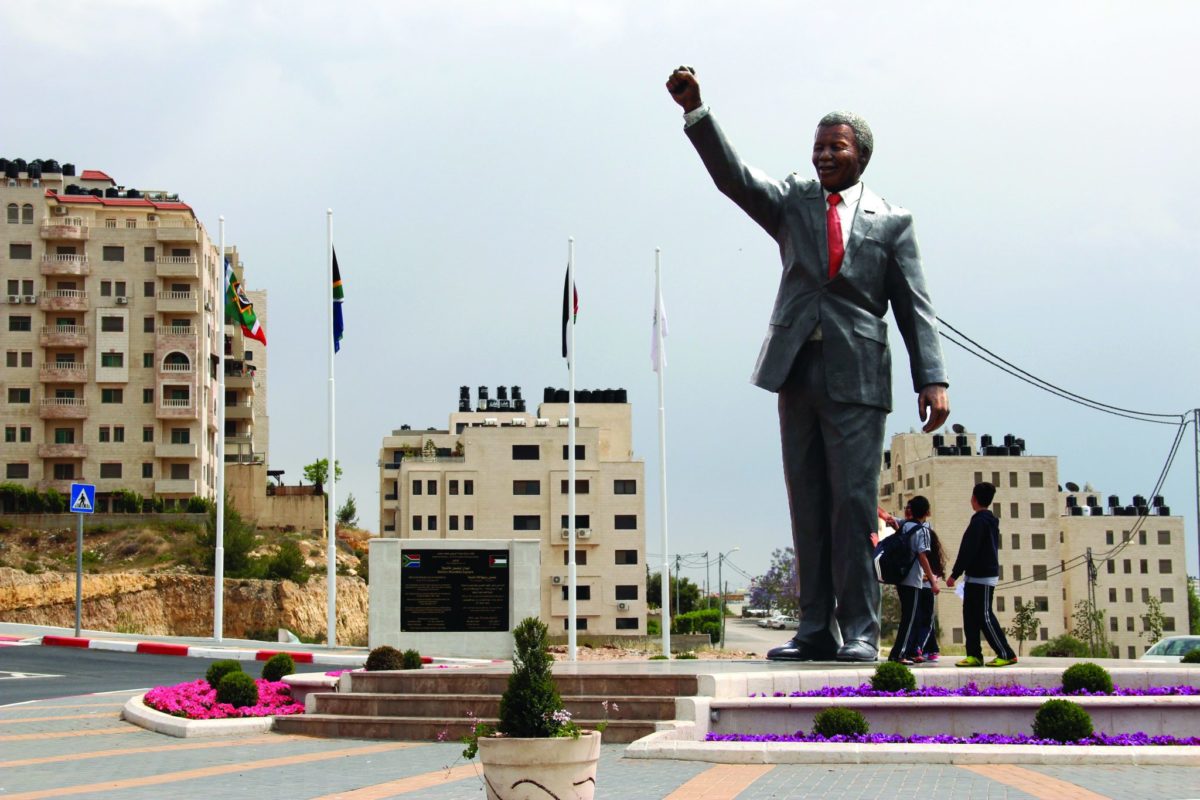 Mandela Stands Tall Over People Fighting For Liberation