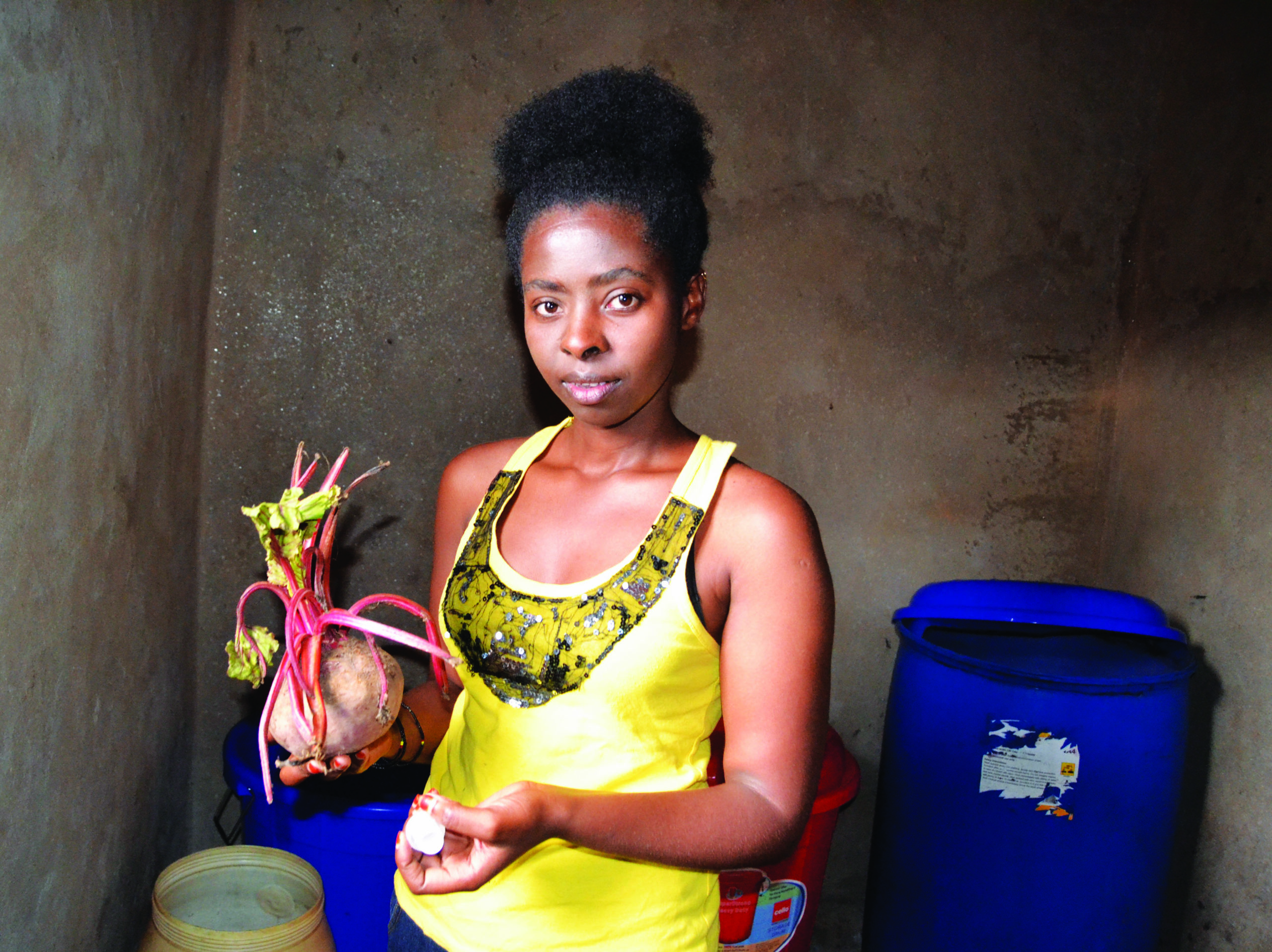 Assumpta Uwamariya showing a beetroot ( in her right hand) at Mahoko Centre in Rubavu District, on January 20, 2017 (Emmanuel Ntirenganya)