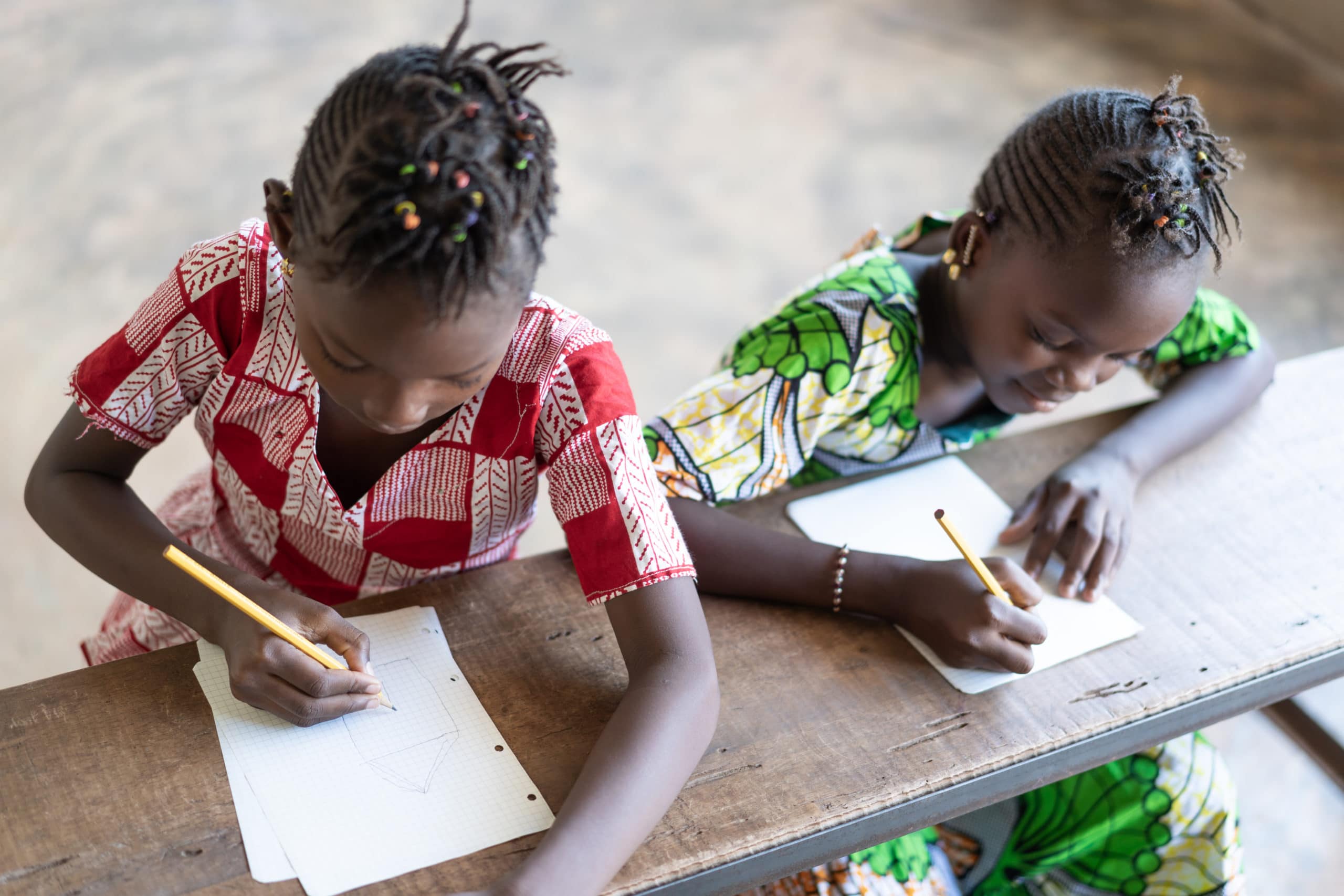 Two beautiful African children sitting in Classroom in Bamako, Mali