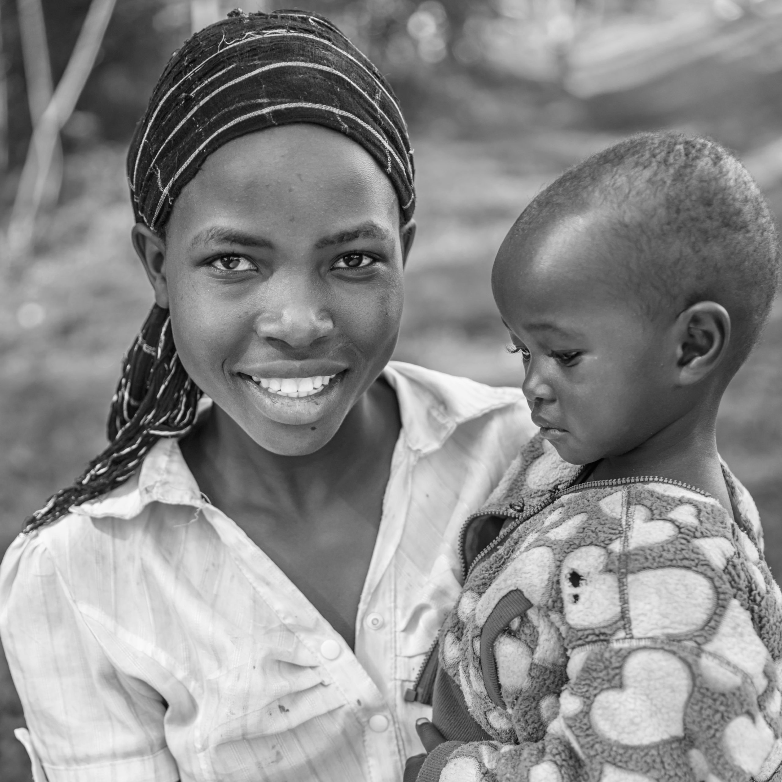 Young African woman holding her baby, Kenya, East Africa