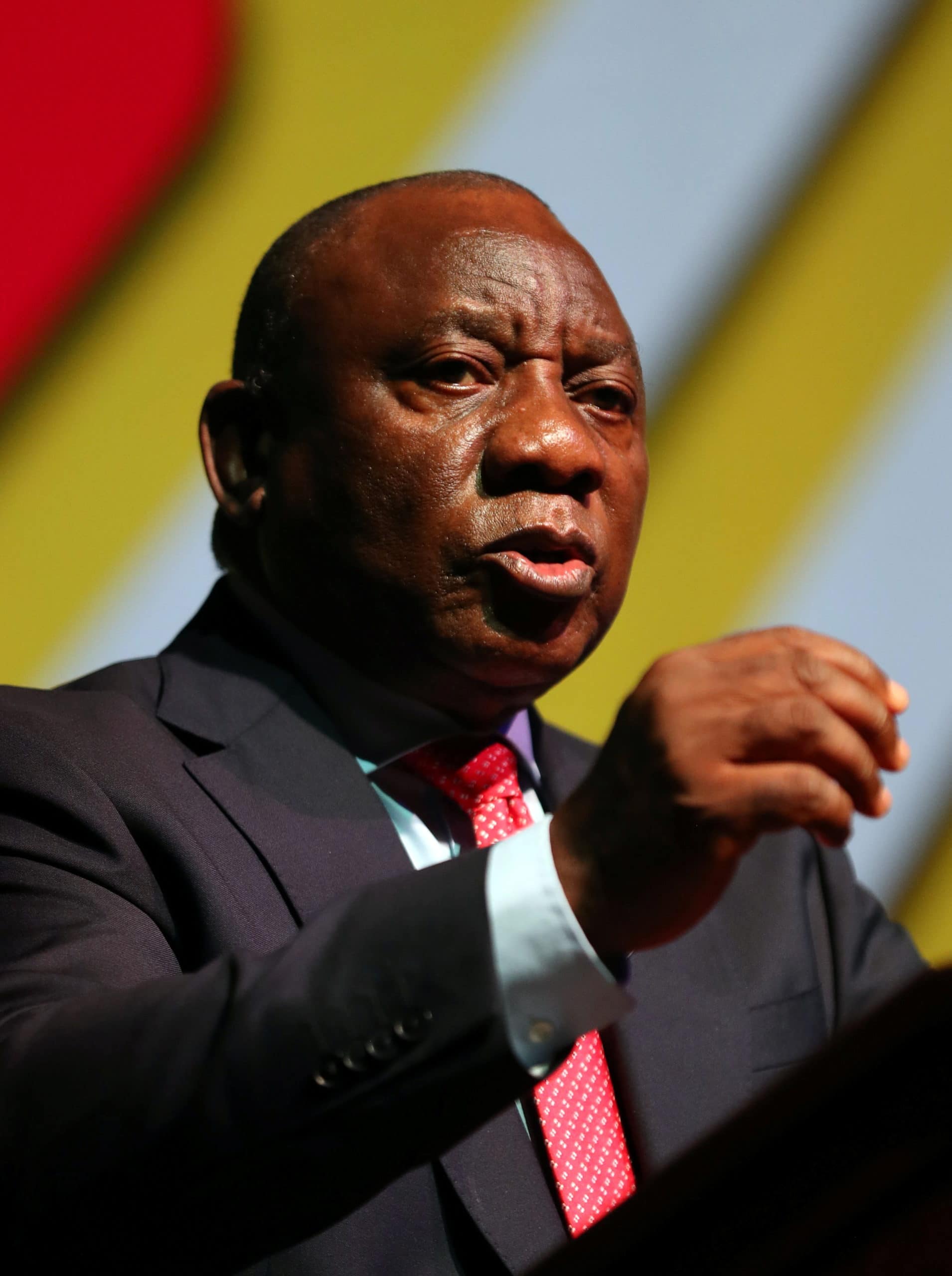 South African President Cyril Ramaphosa gestures as he delivers the opening address during the 3rd South Africa Investment Conference in Sandton