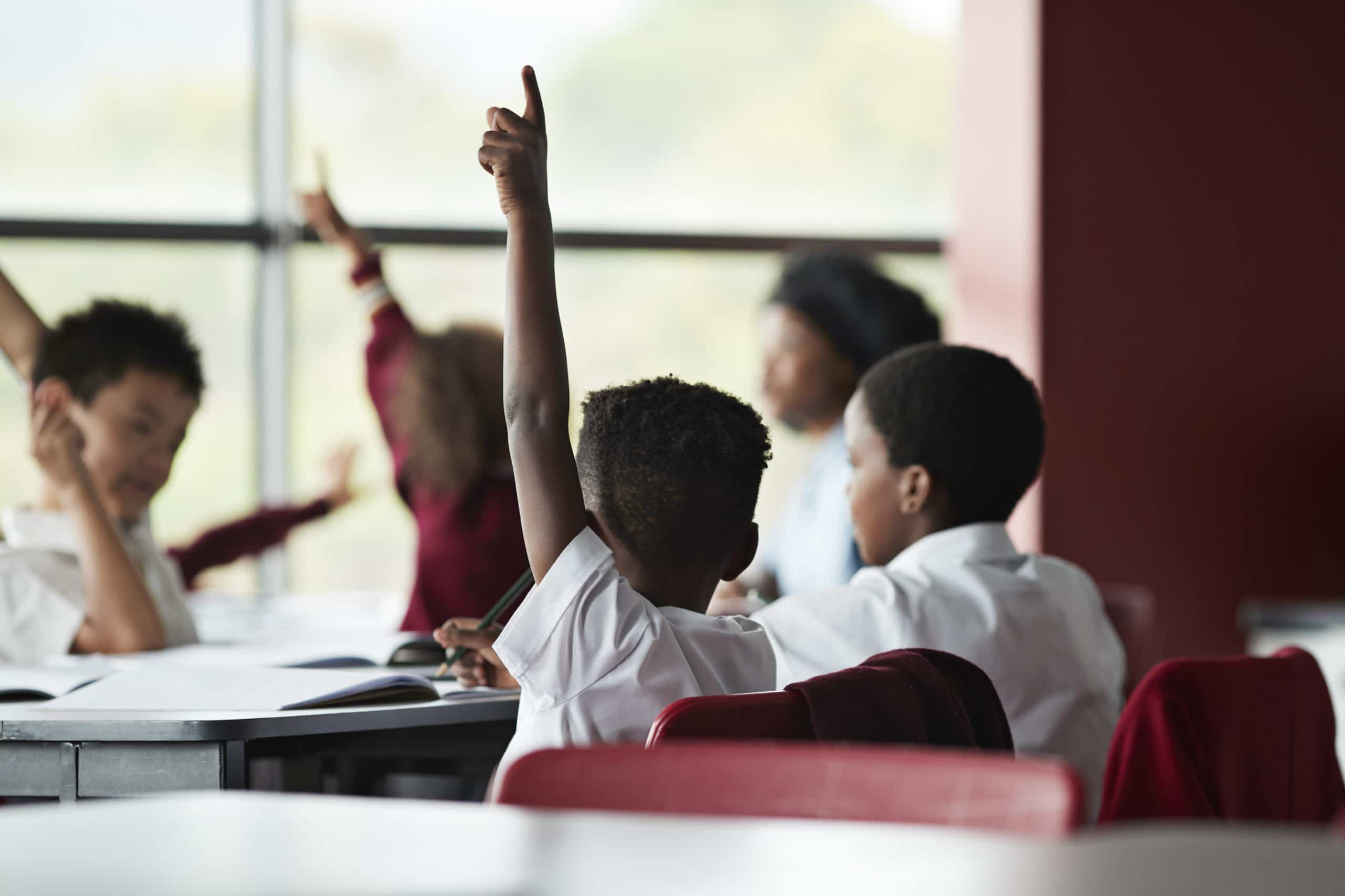 Focus on raised hands in classroom