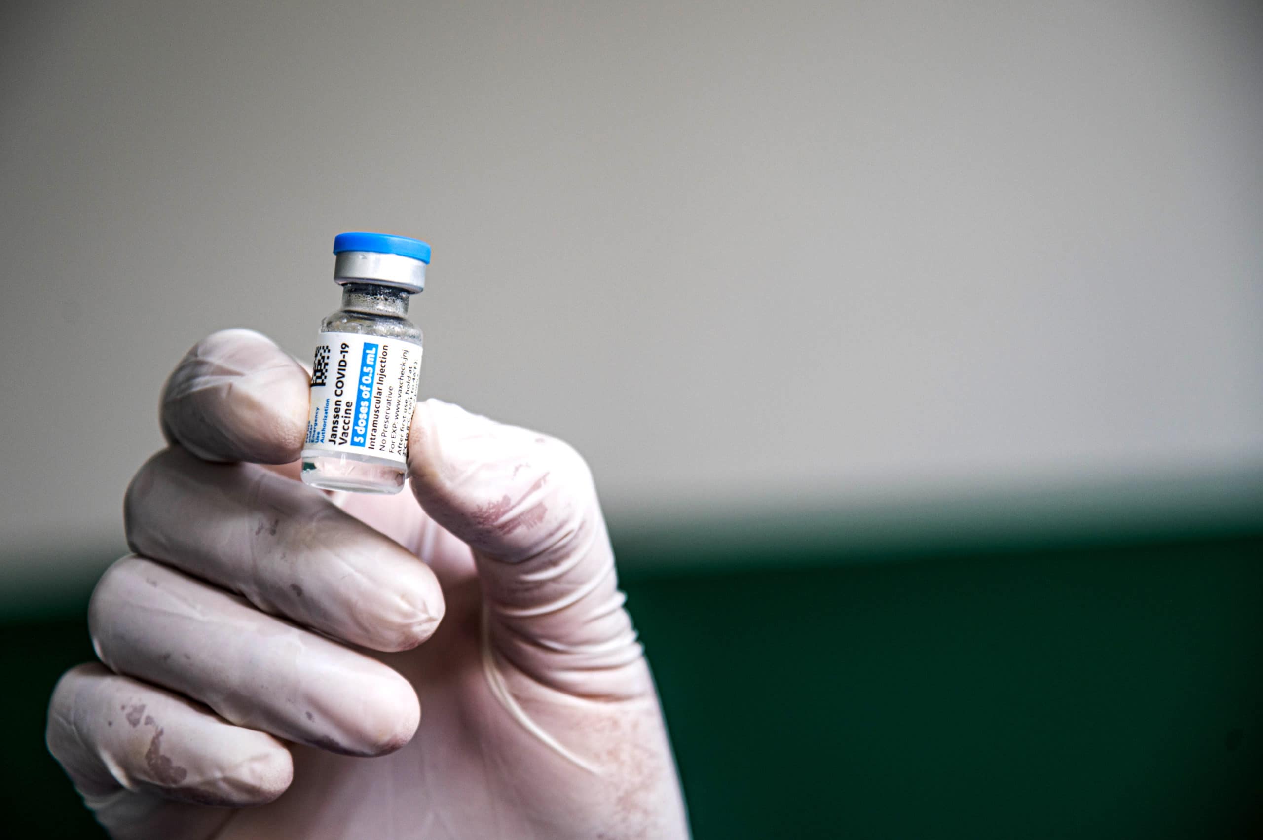 A health worker holds a vial of Janssen vaccine (American