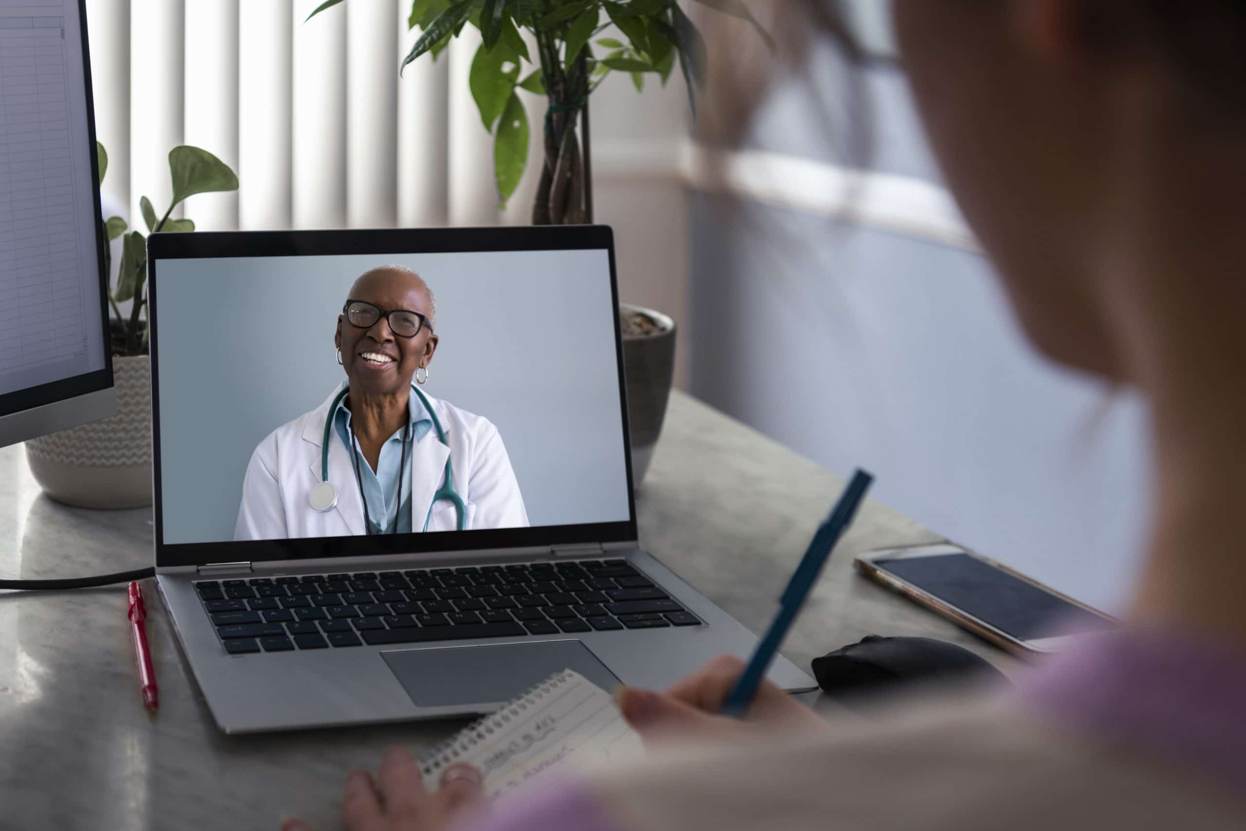 Woman talking to doctor on video call