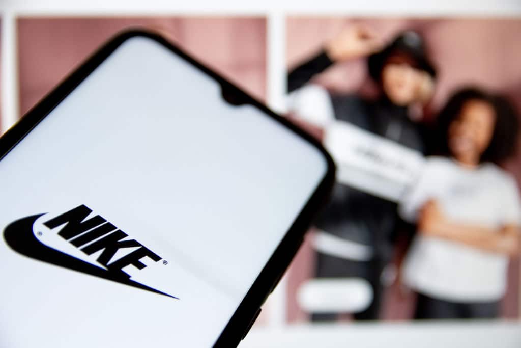 In this photo illustration a Nike logo seen displayed on a