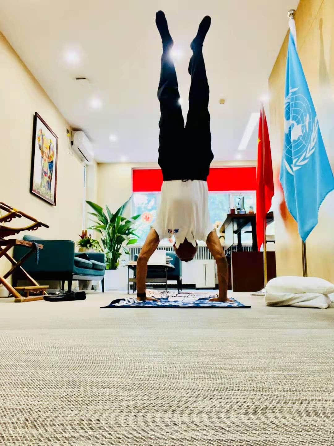 Siddharth Chatterjee practicing handstand at office during lunch break