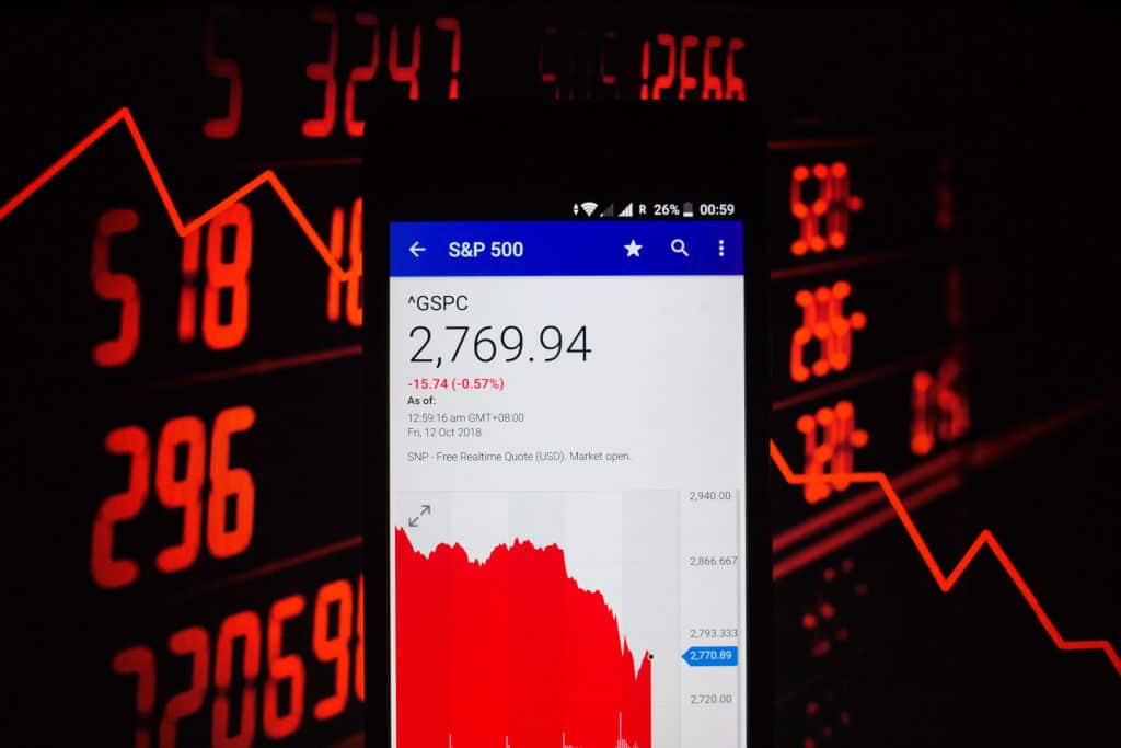 A smartphone displays the S&P 500 market value on the stock