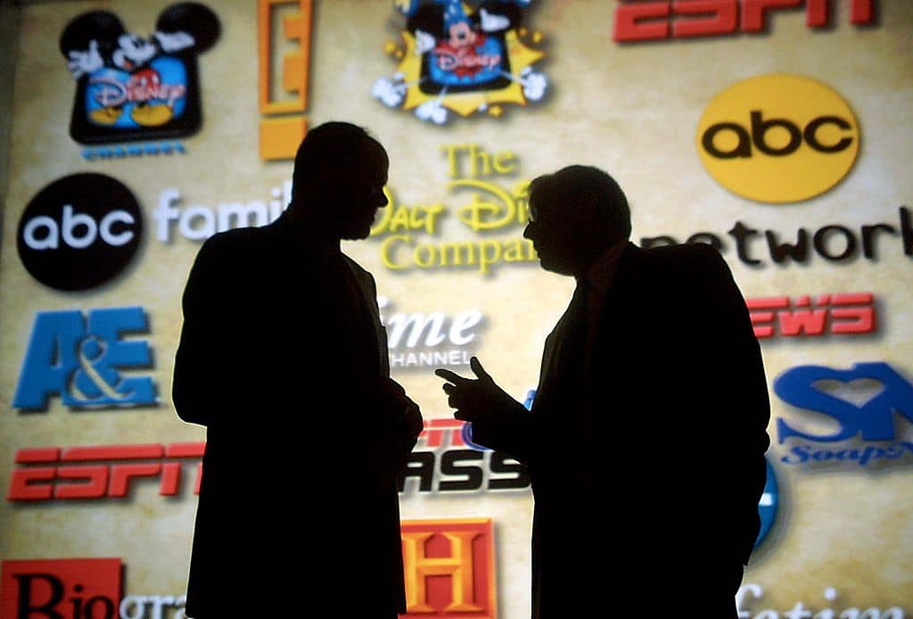 Michael Eisner (L), chairman and CEO of the Walt D
