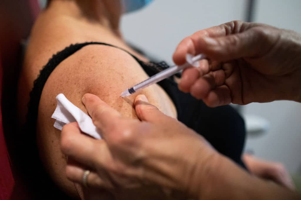 Injection of the third dose of the covid 19 vaccine at a Covid-19 vaccination center in Dinan, Brittany