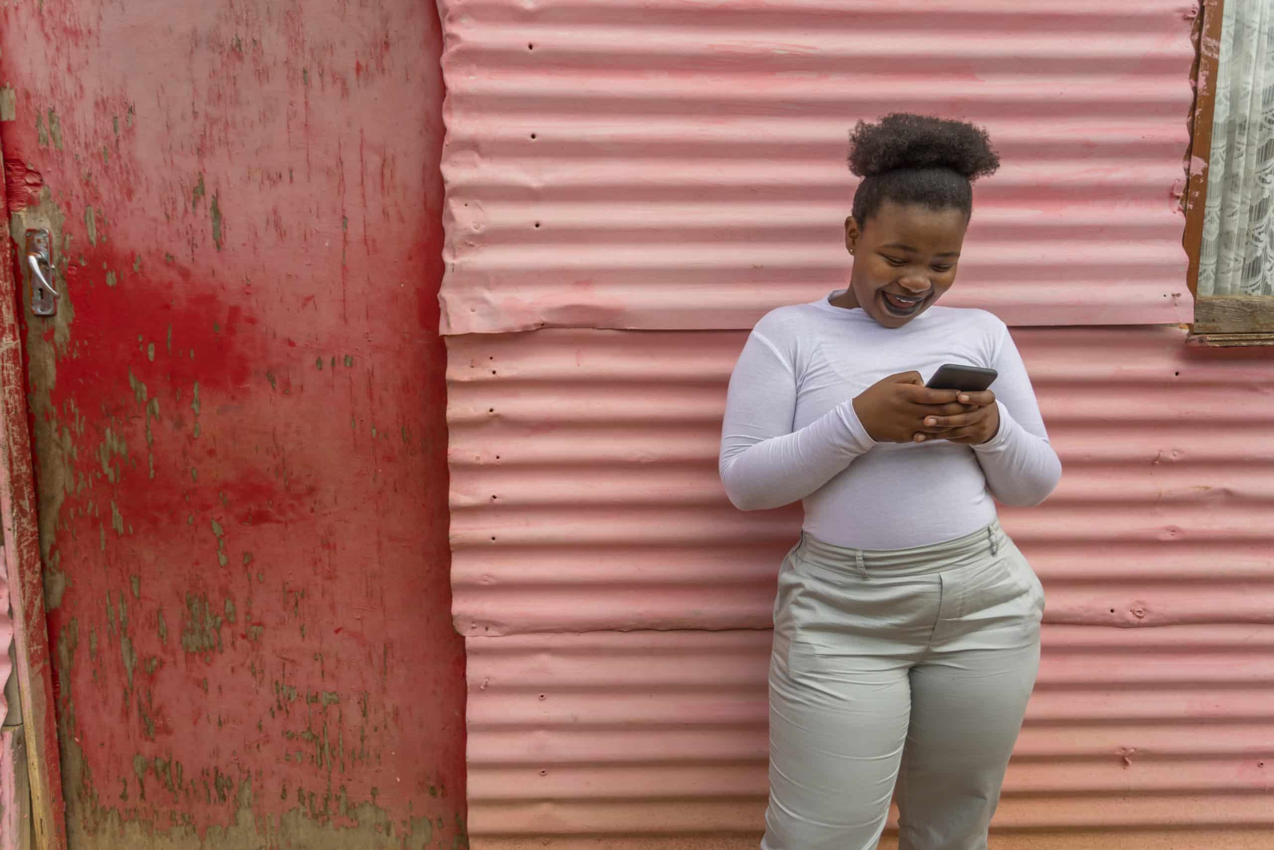 Young Happy African Woman Using a Mobile Phone