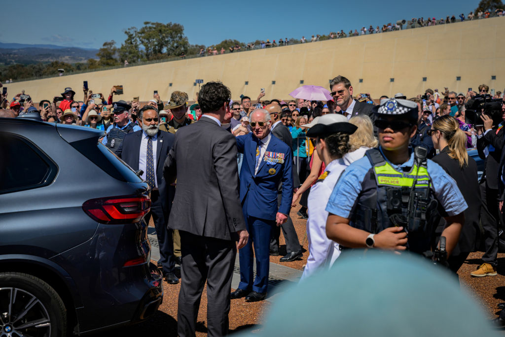 King Charles is seen waving the crowds before he leave the