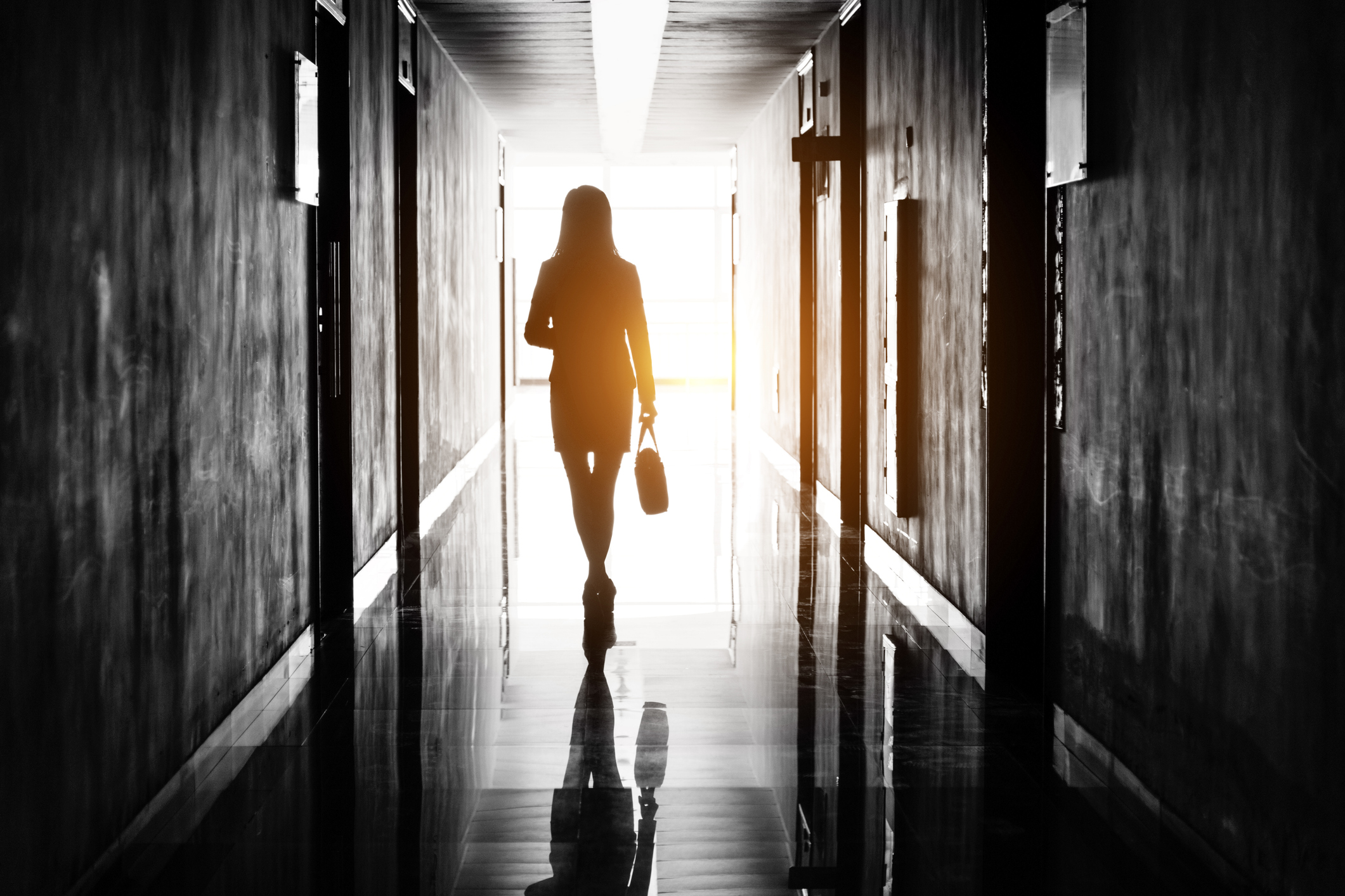 Businesswoman through the office corridor